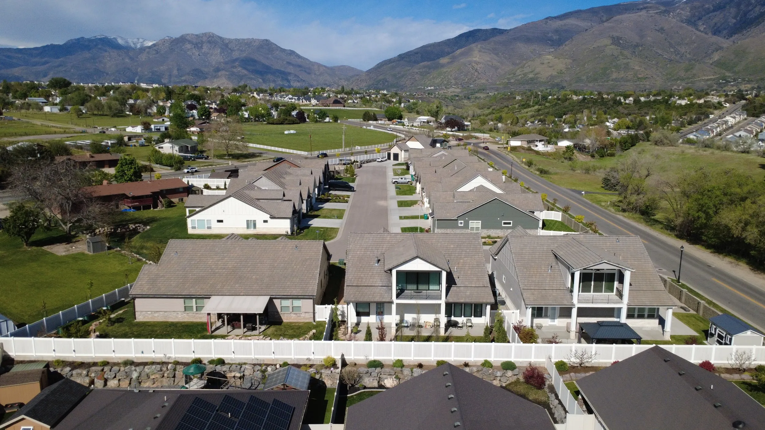 Aerial view of the community from the south with the valley beyond