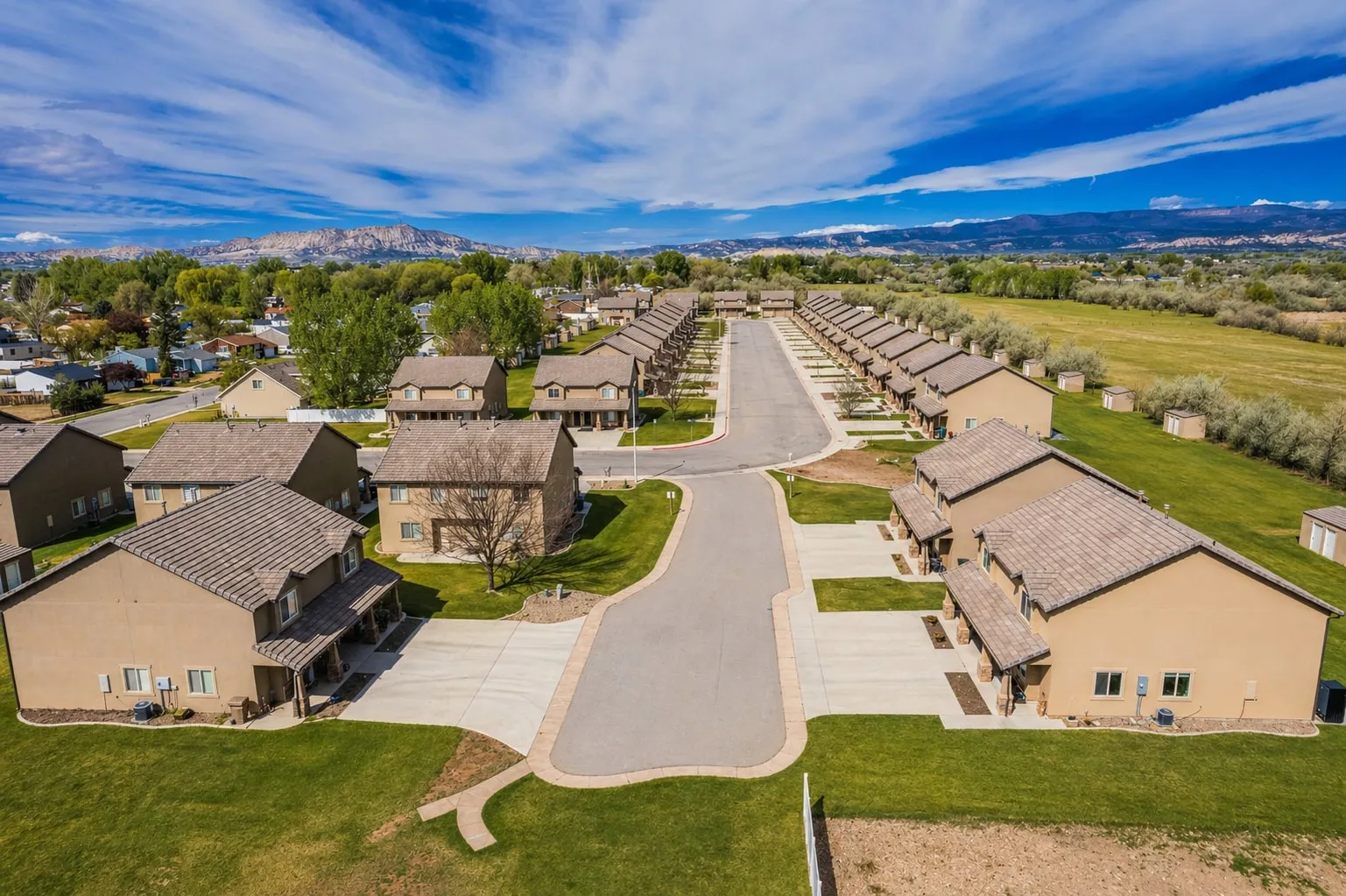 Aerial view of the community entry drive and surrounding homes