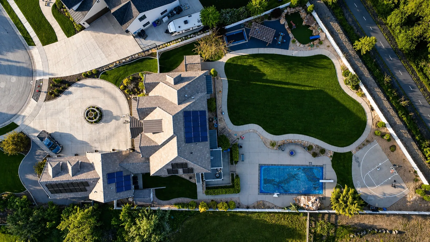 Overhead aerial of the full property showing roof, pool, and grounds