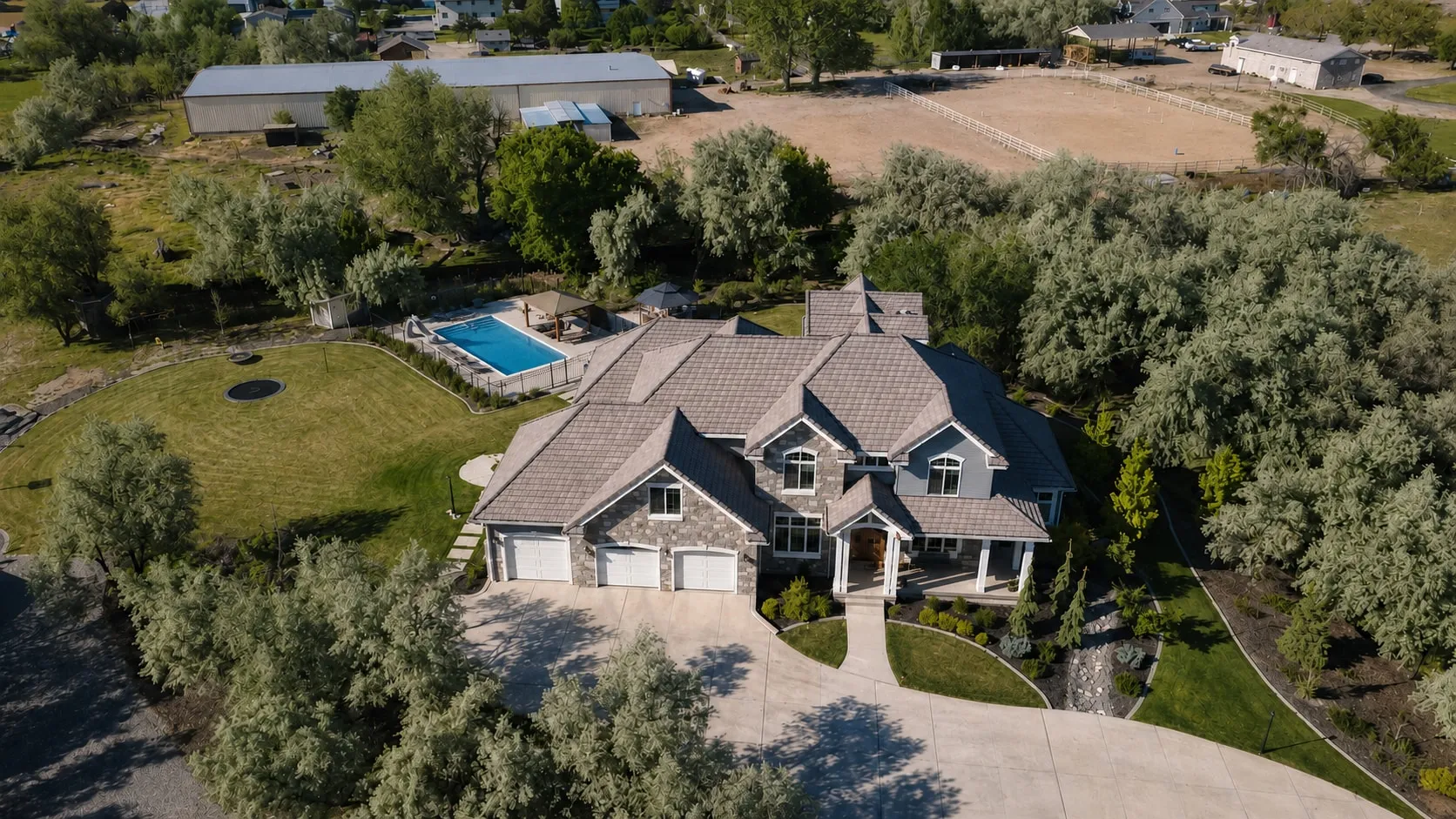 Aerial view of the completed home and its full grounds