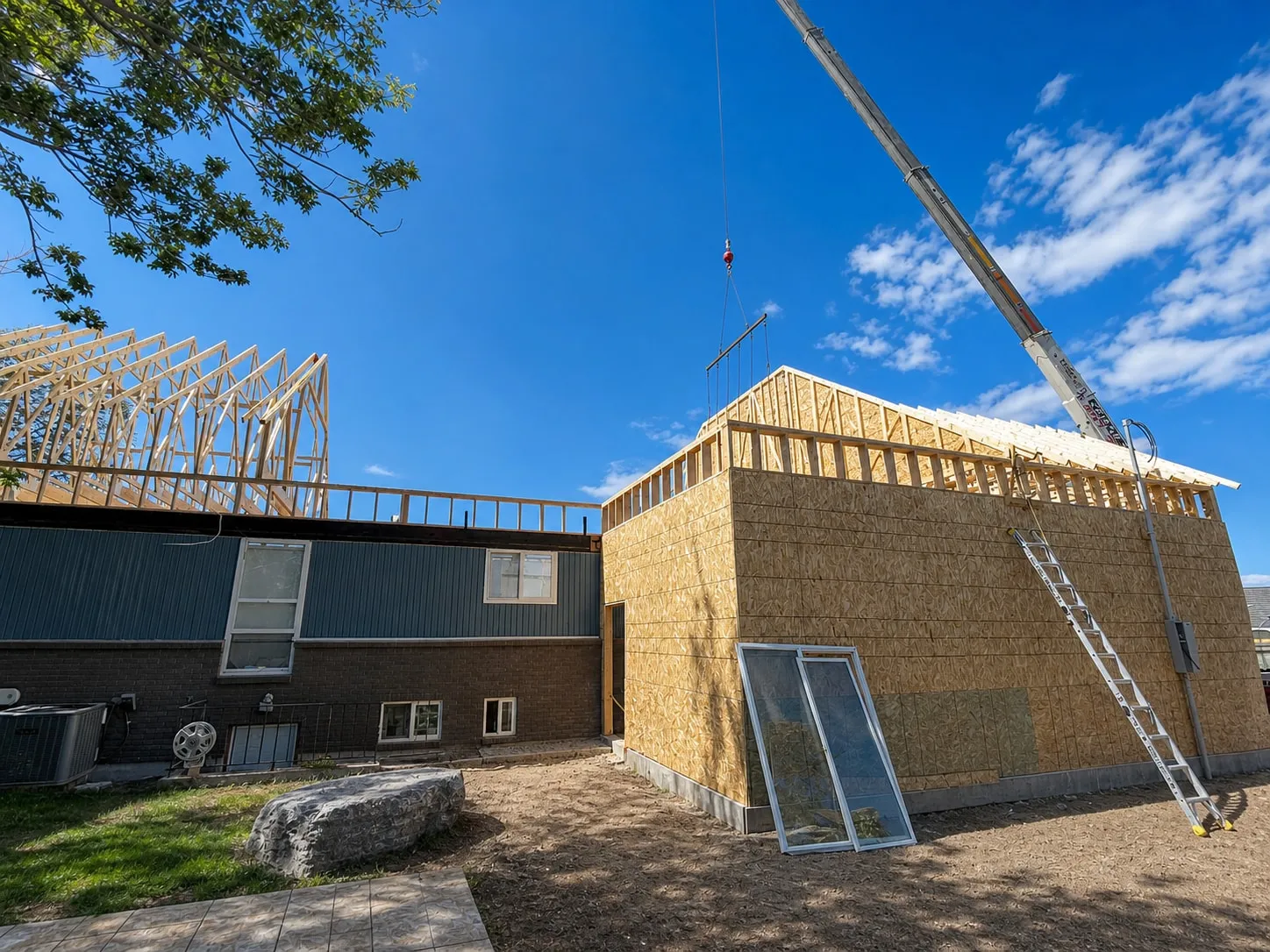 The new roofline being framed above the original structure