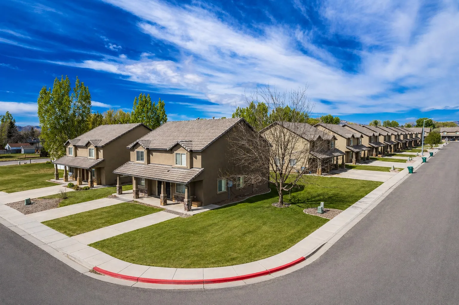 Corner townhome building with covered entries