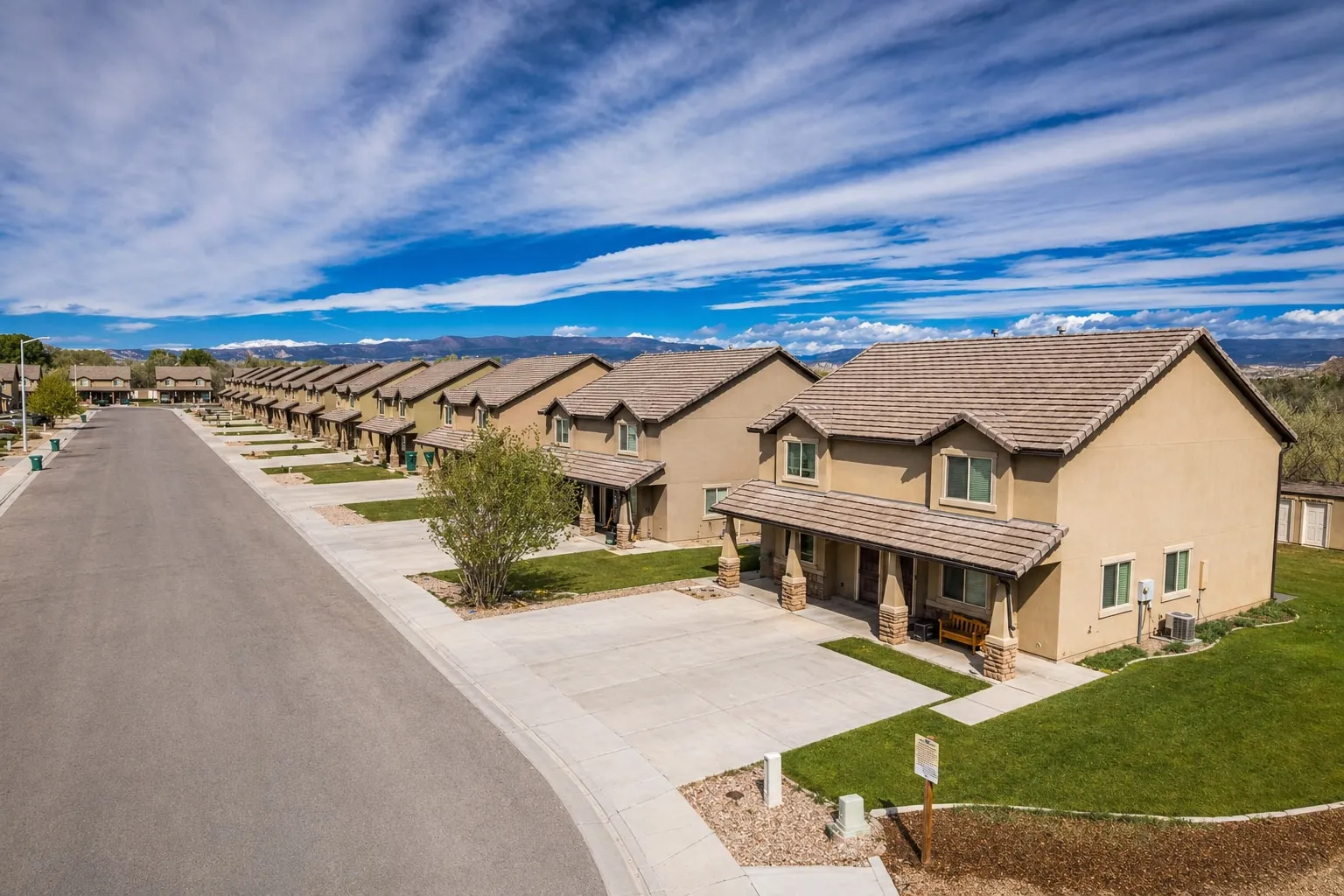 Row of completed townhomes along an interior street